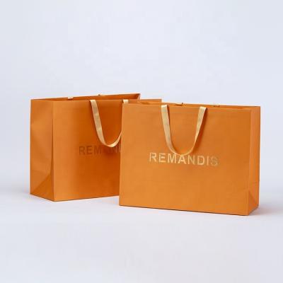 China Recycled Materials Personalized Custom Full Print Book Exquisite Printing Luxury Toys Packaging Paper Bag With Ribbon Handle for sale