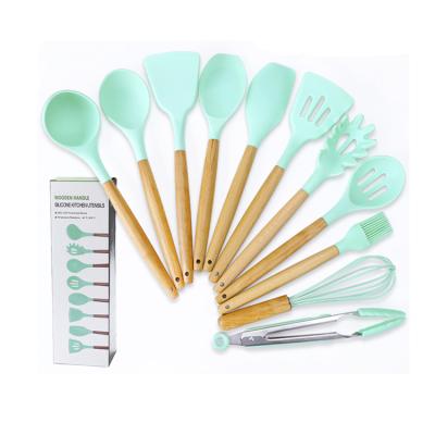 China Amazon Best Viable Selling Natural Wood Kitchenware 11pcs Handle Silicone Cookware Set for sale