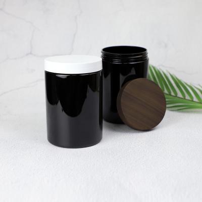 China Customized Round 750ml Cosmetic Plastic Jar Matt Black Hair Mask Body Scrub Plastic Cosmetic Jar With Lids for sale