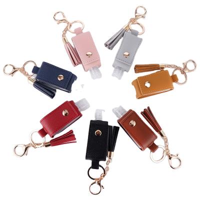 China Mini Creative Goods Among The Tassel Portable Key Cover Bottle Sanitizer Key Chain PU Hand Pendant Exquisite Gift for sale