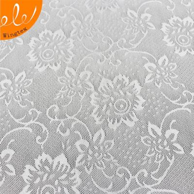 China Stretch 140g 90 nylon spandex 10 knit stretch flower jacquard mesh powernet fabric for sale