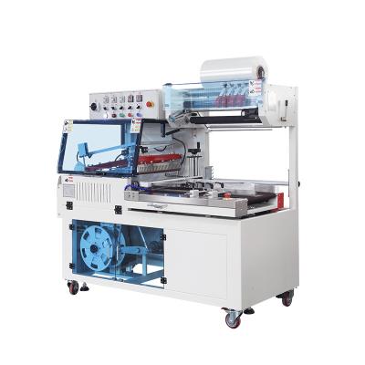 China Food BSF-5640LG Hualian 2 In 1 Sealing And Cutting L Bar Orbital Tunnel Cheese Pizza Phone Box Sleeve PE Film Shrink Wrapping Machine for sale