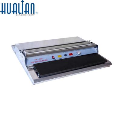 China Food TW-550E HUALIAN Semi-Automatic Vegetable Fruit Food Cling Film Wrapping Machine for sale