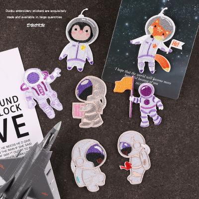 China Self Adhesive Custom Cloth Clothing Accessories Badge Astronaut Cloth Label Hand Register Accessories Computer Embroidery Patch for sale