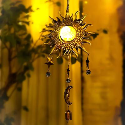 China Modern Solar Garden Lights Decoration Hanging Sun Star And Moon Decor Crackle Globe Metal Warm White Led Glass Wind Rings Outdoor for sale