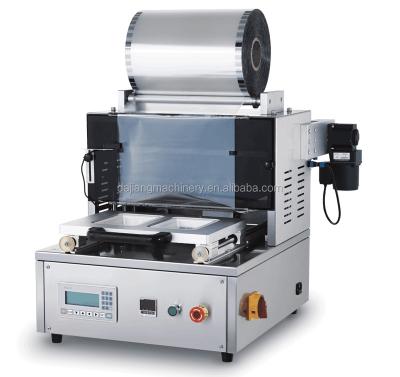 China DX-1 Food Plastic Case Sealing Machine Food Sealing Machine Tray Sealer Four Side Sealing Packing Machine for sale