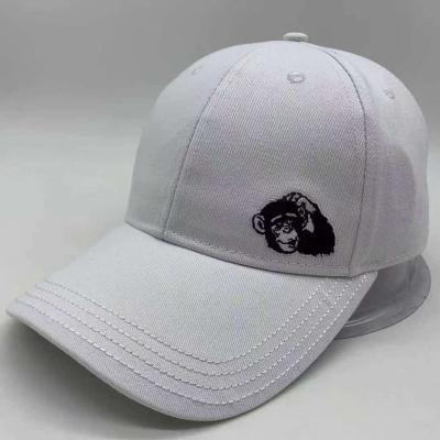 China COMMON hat in black and white color stitching with monkey embroidery logo for sale