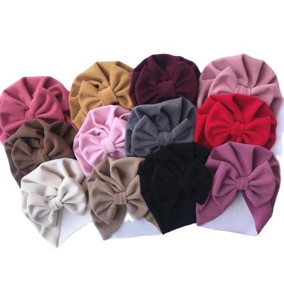 China Beanie Hat Winter Toddler Warm Turban Bow Baby Hood Soft Faux Cashmere Baby Solid Color Picture Large for sale