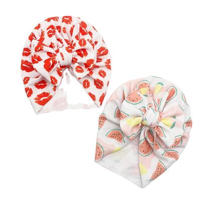 China New Arrival Picture Flower Printed Big Bow Baby Hat 0-3Y Toddler Girls Beanie Turban for sale