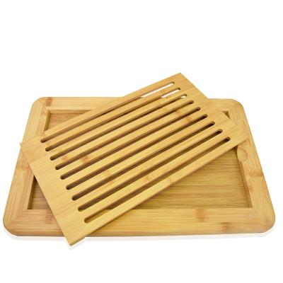 China Sustainable Premium Bamboo Wood Perfect Size  Bread Cutting Board With Slots For Bread Crumb for sale