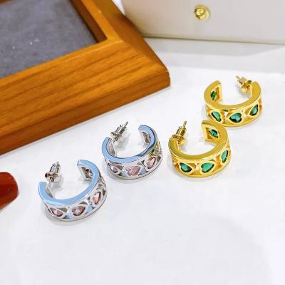 China Fashion Trendy Tasty 18K Gold Plated Heart Huggie Earrings Micro Pave Zircon Crystal Heart Small Hoop Earrings Women for sale