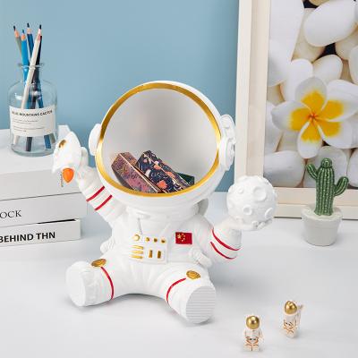 China Large Size Europe Astronaut Desktop Storage Decoration 28*20.5*26 Customized Professional Solid Resin Desktop Storage for sale