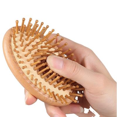 China Sustainable Premium Wooden Bamboo Hair Brush Improve Hair Growth Wooden Hairbrush Prevent Hair Loss Comb Bamboo Teeth for sale