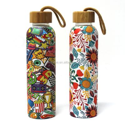 China 600ml Full Wrap Eco Friendly Sustainable Printing Glass Water Bottle With Bamboo Lid Borosilicate Glass Sports Reusable Water Bottle With Rope for sale