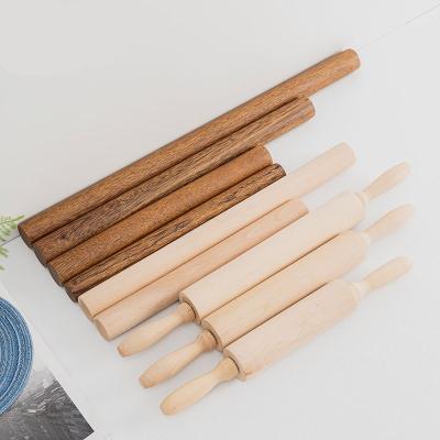 China Theaceae Sustainable Household Wood Non Stick Flour Dough Small Kid Solid Classic Rose Gold Embossed Wooden Roll Pin For Kitchen for sale