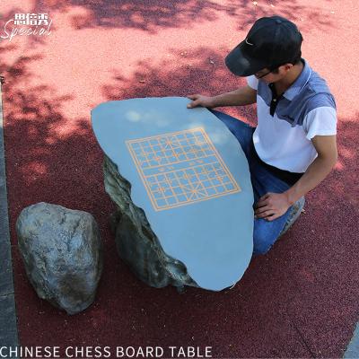 China Outdoor rainproof courtyard simulation rock sculpture with Chinese customized stone chessboard table stool for sale