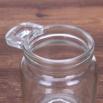 China Minimalist 250ml Single Ear Clear Glass Spice Storage Bottle With Cork And Wooden Spoon for sale