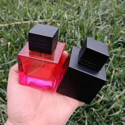 China 100ml Empty Cosmetic Matt Black Cube Perfume Bottles With Wooden Cap Custom Gradient Color Perfume Bottle for sale