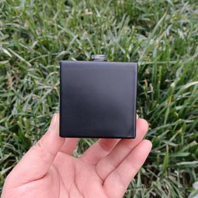 China 100ml Empty Cosmetic Matt Black Cube Perfume Bottles With Wooden Cap Custom Gradient Color Perfume Bottle for sale