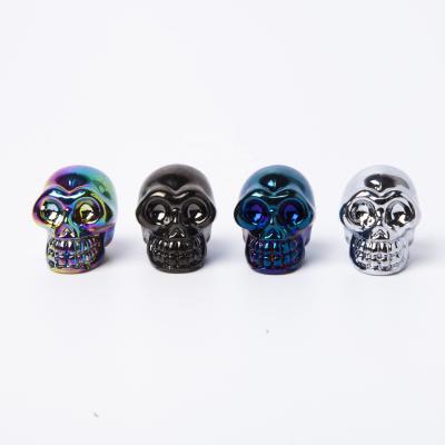 China Aura Europe Size Mini Crystal Skulls Glass Crystal Cutouts Skulls Carved For Decoration And Gift for sale