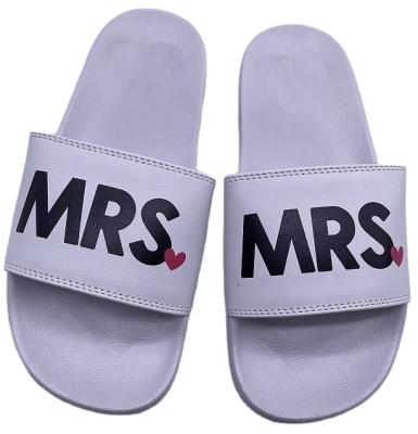 China Fashion Trend Good Quality White Wedding Printed Logo PU Customized Slippers For Women Slip On Slippers Leather Foam Quilted Slide Slippers for sale