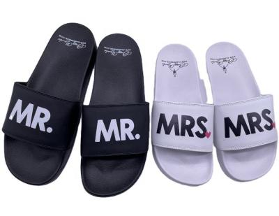 China Fashion Trend Customized Print Logo Big Size Womens Unisex Couples Bedroom Sandals Outdoor Home Custom Design White PVC Slide Slippers for sale