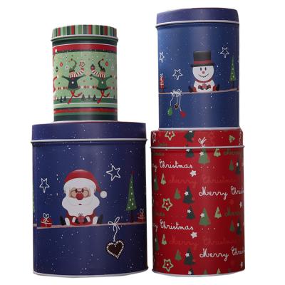 China Christmas Tinplate Four-piece Can Round Christmas Gift Metal Tin Box For Candy Cookie Tea for sale