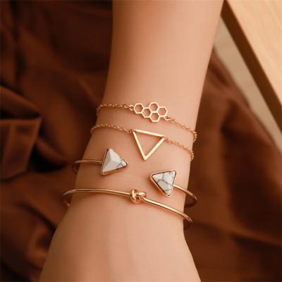 China Fashion Environmental Friendly Gold Plated 4 Pcs Shape Diamond Knotted Cuff Bangles Honeycomb Triangle Bracelets Set Women for sale