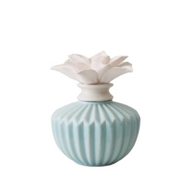 China Decorative Home Decorative Ceramic Essential Oil Diffuser With Hand Made Porcelain Flower for sale