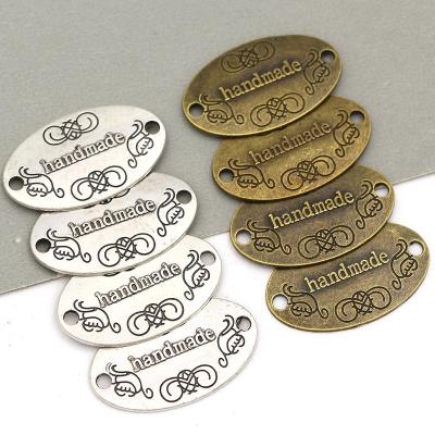 China Ready to Ship Bag Logo Metal Labels Handmade for Sewing Metal Logo Fast Delivery Scarf Clothes and Hats Metal Logo Sign for sale