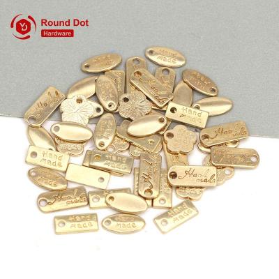 China Bag Multiple Applications Customized Metal Labels OEM ODM Brand Logo Metal Plates Custom Clothes Sewing Tags for sale