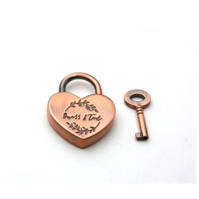 China Decorative Bag Heart Shape Metal Lock Brushed Finish Customized Logo Engraved Bag Lock Handbag Metal Craft for sale