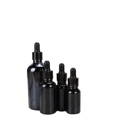 China 2021 Premium Serum Oil Cosmetic Packaging 1oz 30ml Matte Black White Glass Bottles Dropper Bottles for sale