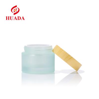 China Direct Selling l High Quality Round Body Bottle Cosmetic Factory Frosted Glass Sets CAP GLASS BAMBOO BOTTLE for sale