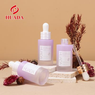 China Hot Sale Customized Cosmetic Bottle Essential Skincare Purple Dropper Packaging Bottles Cylinder Lotion Bottles With Pump for sale