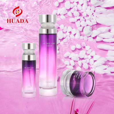 China Wholesale Cosmetic Pump Oil Bottle Gradient Fuchsia Glass Squeezing Bottle Skin Care Set Glass Cream Bottle for sale