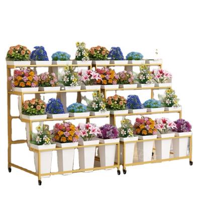 China Battery & small machinery flower pot rack display rack rectangle iron metal flower pot display rack flower bucket display stand with wheels for sale