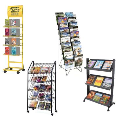 China Floor Retail Metal Comic Book Display Rack Stand Metal Comics Display Rack With Wheels Custom Size Accepted for sale