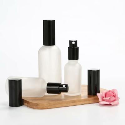 China Matte Glass Household Products Containers For Cosmetics Toner Bottle 100ml Black Spray Bottles Glass Spray Bottle for sale