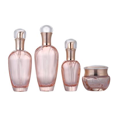 China Customized Wholesale Pink Body Lotion Bottle Cosmetic Oil Bottle Frosted Glass Cosmetic Packaging for sale