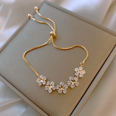 China Fashion High Quality SY Beautiful Flower Adjustable Zircon Gold Five Charm Bracelet for sale