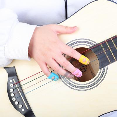 China Guitar LoversNovice Anti-Slip Training Finger Covers Cradle Sets and String Exercises Guitar Silicone Finger Protector for sale