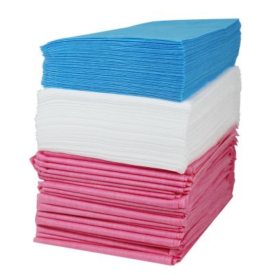 China 100% PP Bed Sheet Non Woven Waterproof Disposable Nonwoven Sheet Customized Size 100% PP Bed Sheets With Cross Holes for sale