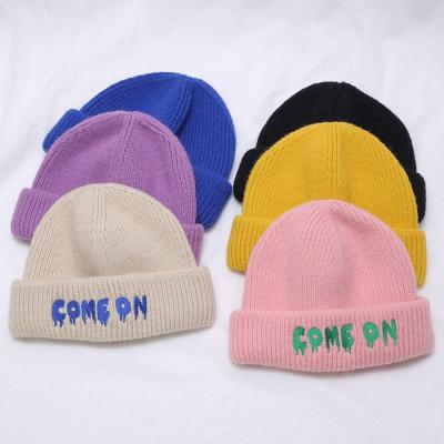 China 2021 Retro COMMON Autumn Winter New Solid Color Letter Embroidery Winter Hat Skull Cap for sale