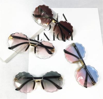 China Fashion Sunglasses Wholesale Fashion Round Metal Sunglasses Children Rimless Flower Shape Sun Glass Gradient Shades Female Sunglasses for sale