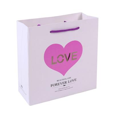 China Recycled Materials Love Style Wedding Decorative Gift Paper Bag Candy Gift Heart Shaped Paper Bag for sale