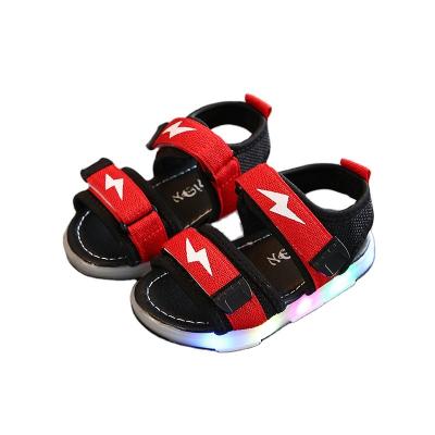 China 2021 Summer Light Children's Shoes Girls Beach Shoes Korean Style Cavity Breathable Soft Sole Girls Sandals LED Lights Shoes for sale