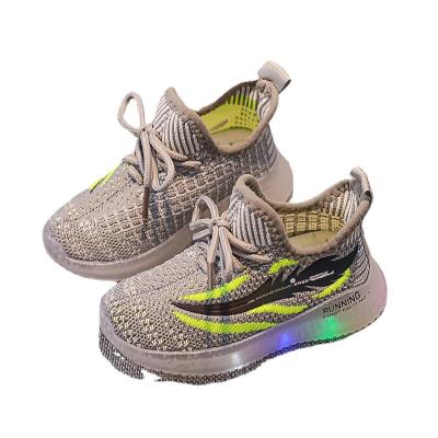 China Breathable Boys And Girls Luminous Coconut Shell Shoes , Kids Flying Woven Running Shoes Led Lightweight Sports Shoes for sale