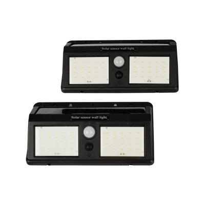 China Seguridad exterior de alta potencia de aluminio IP65 sensor solar negro luz de pared en venta