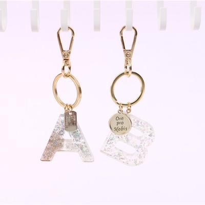 China New Popular Glittering Gifts Souvenir Transparent Acrylic Resin Letter Key Chain Luggage Pendant for sale